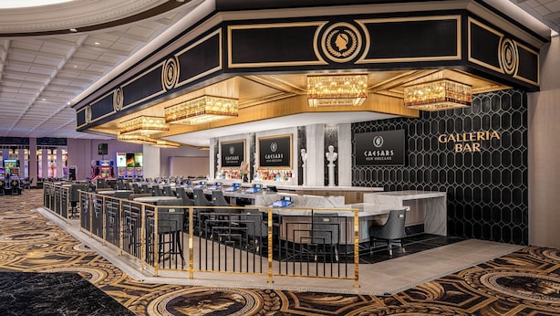 A Galleria Bar with a marble counter, multiple bar stools, and a patterned carpet. - Caesars New Orleans Hotel & Casino - A Caesars Rewards Destination (New Orleans)