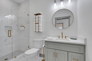 Shower, hair dryer, towels, soap