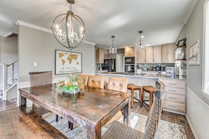 A spacious kitchen with wooden cabinets, a large island, and modern appliances. - 'The Restful Retreat' Mtn-View Alto Group Getaway (Alto)