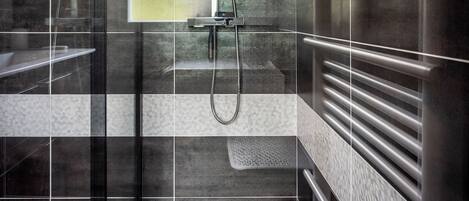 Shower, hair dryer, towels, toilet paper