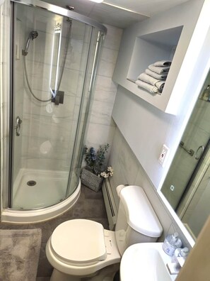 Shower, hair dryer, towels, soap