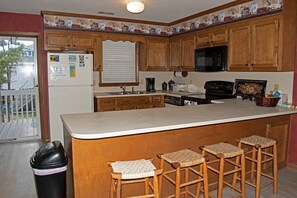 Fridge, microwave, oven, stovetop - 4 Bedroom Third Row Cozy Beach Cottage (Ocean Isle Beach)