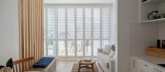 Stylish Sunny Matakana Townhouse Steps to Shops + Indoor-Outdoor Living.