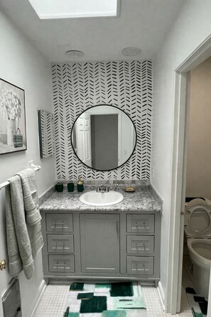 Shower, towels, soap, toilet paper