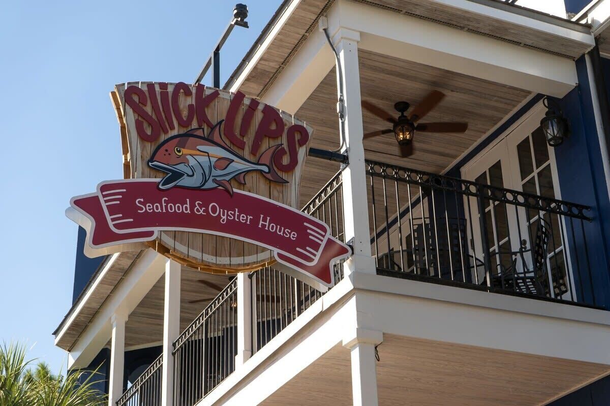 A building with a sign that reads "Slick Ups Seafood & Oyster House."