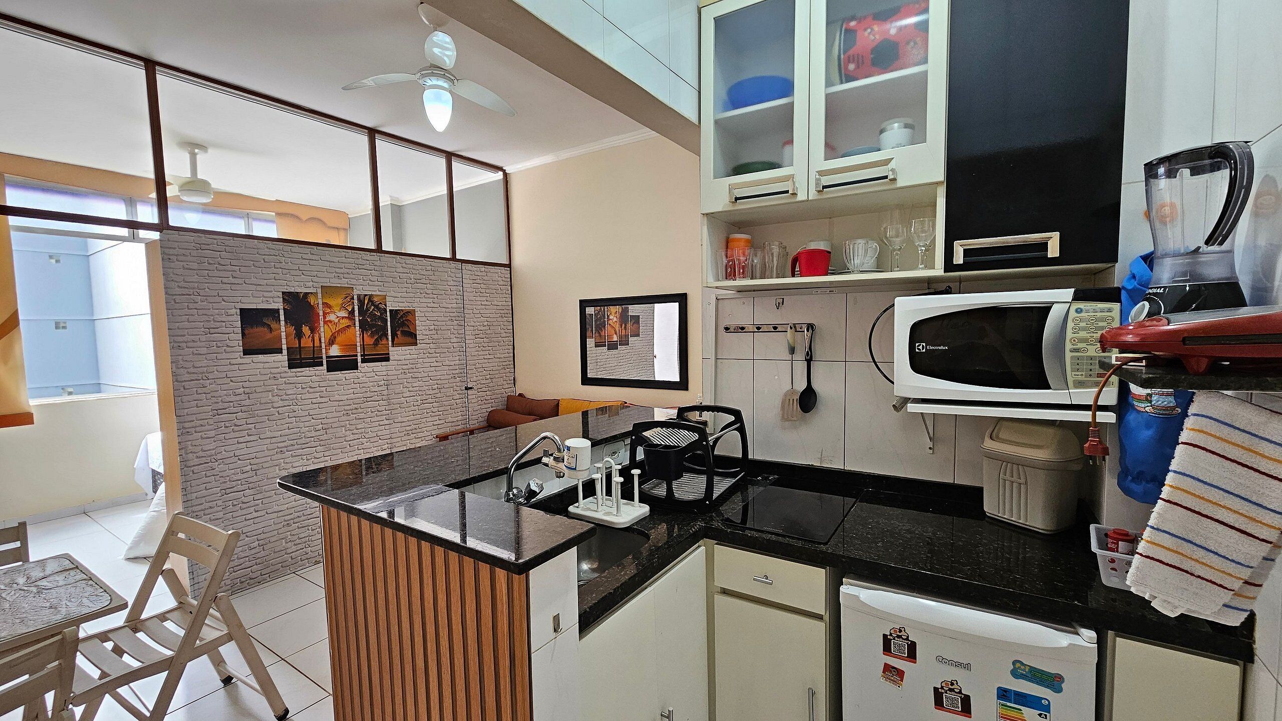 Fridge, microwave, coffee/tea maker, cookware/dishes/utensils