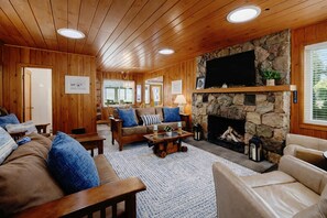 TV, fireplace, books - Lake Huron Getaway w/ Sun Porch & Beach Fun! (Oscoda)