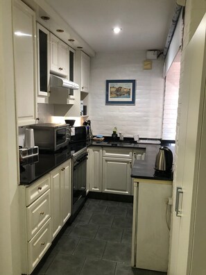 Private kitchen - Puente de la Mujer, your private apartment with the best view in Bs. As. (Buenos Aires)