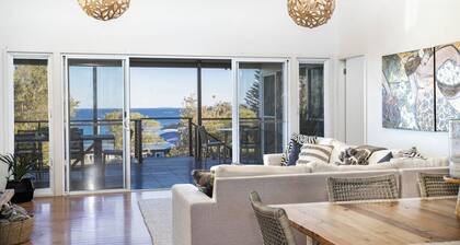 Classic Aussie beach house with amazing views and pet friendly garden.