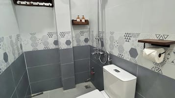 Standard Double Room | Bathroom | Shower, hair dryer, slippers, towels