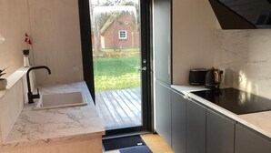 A modern kitchen with a sink, a toaster, and a coffee maker. - VillaVilla 924 - Marielyst, Lolland/Falster/møn (Væggerløse)