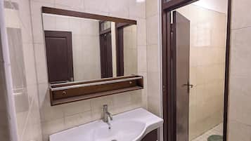 Shower, towels, soap, toilet paper