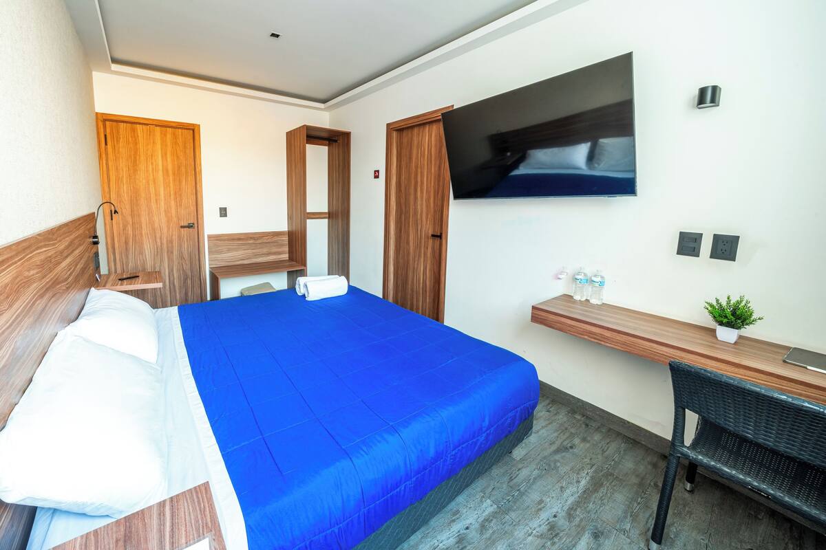 Premium bedding, memory foam beds, desk, laptop workspace