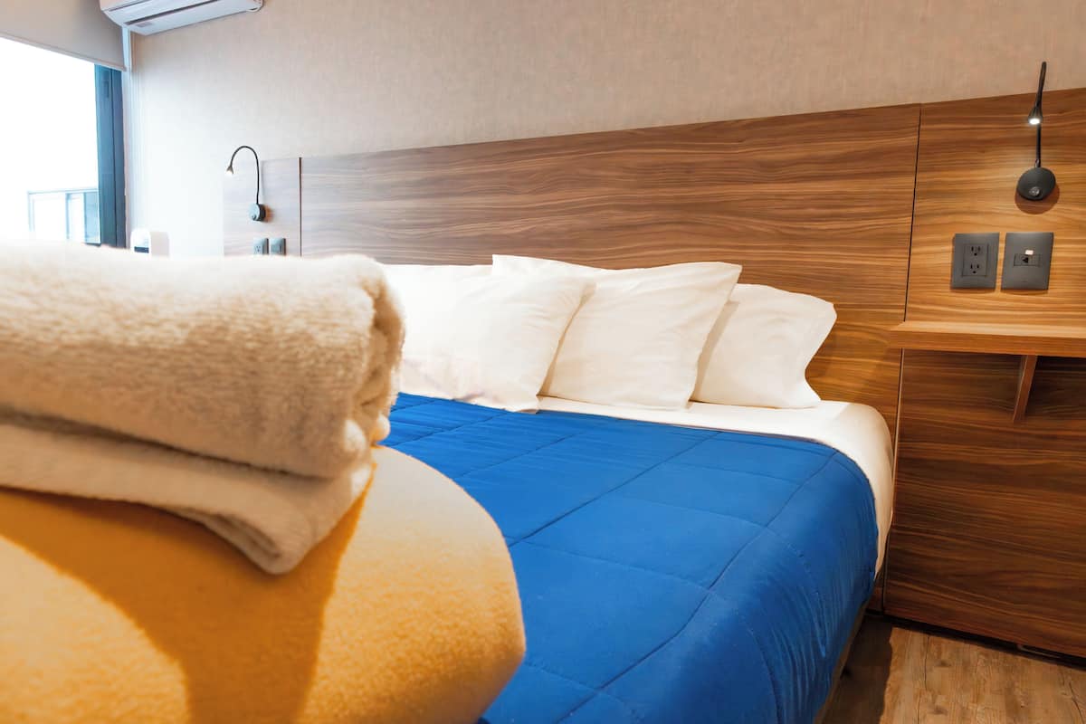Premium bedding, memory foam beds, desk, laptop workspace
