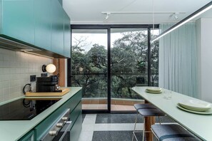 Fridge, microwave, oven, stovetop - Deluxe Nomad Pad • Balcony • By Restaurants | 403 (Cali)