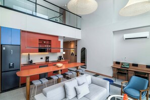 TV, offices - Deluxe Two-Story Penthouse • 2-Bed • Granada | 401 (Cali)