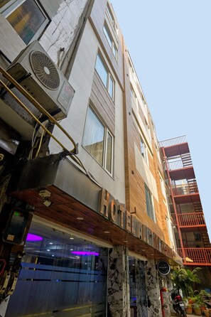 A multi-story building with a sign indicating it is a hotel. - Hotel All Time Residency New Delhi (New Delhi)