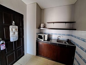Family Room | Private kitchen | Mini-fridge, dining tables - Lily holiday  (Patong)