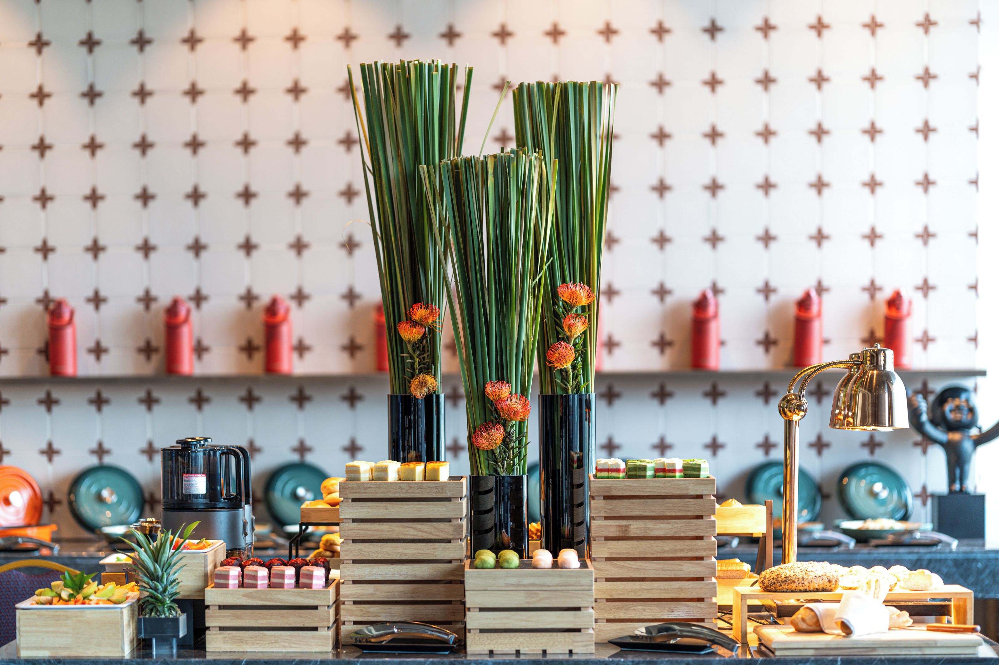 A kitchen counter with various food items and kitchen appliances.