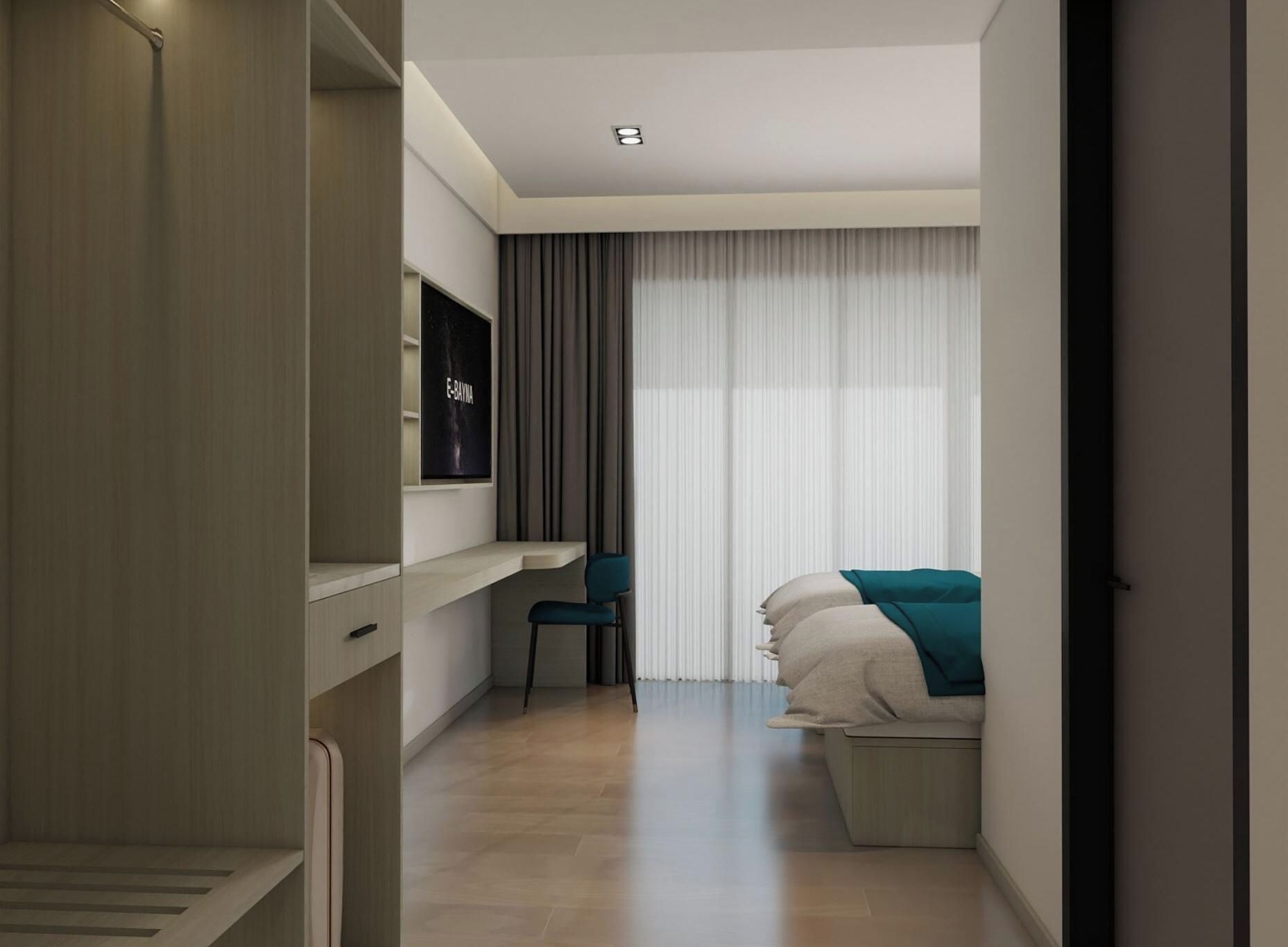 A modern hotel room with a bed, a desk, and a TV.