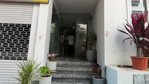 A building entrance with a sign reading "Jyothis Living Spaces". - Jyothis living spaces (Bengaluru)