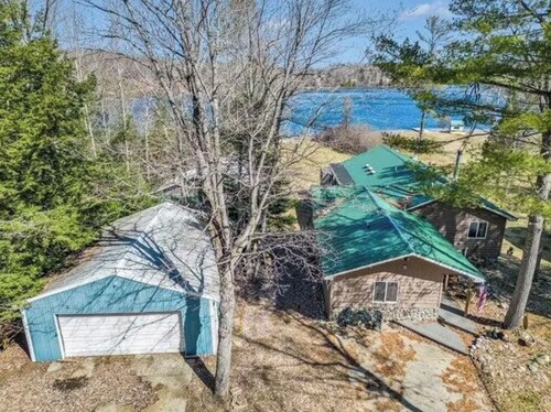 Four-Season Fun at The Birchwood Lodge – Private Dock, Sauna, Trails & Lake View