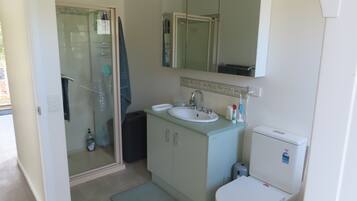 Shower, hair dryer, towels, toilet paper