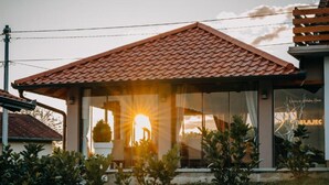 A house with a tiled roof, a large glass window, and a sign that reads "BELAJEC". - Belajec Wine & Nature Retreat (Popovaca)