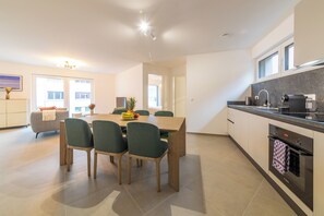 Comfort Apartment | Private kitchen | Full-size fridge, microwave, oven, stovetop