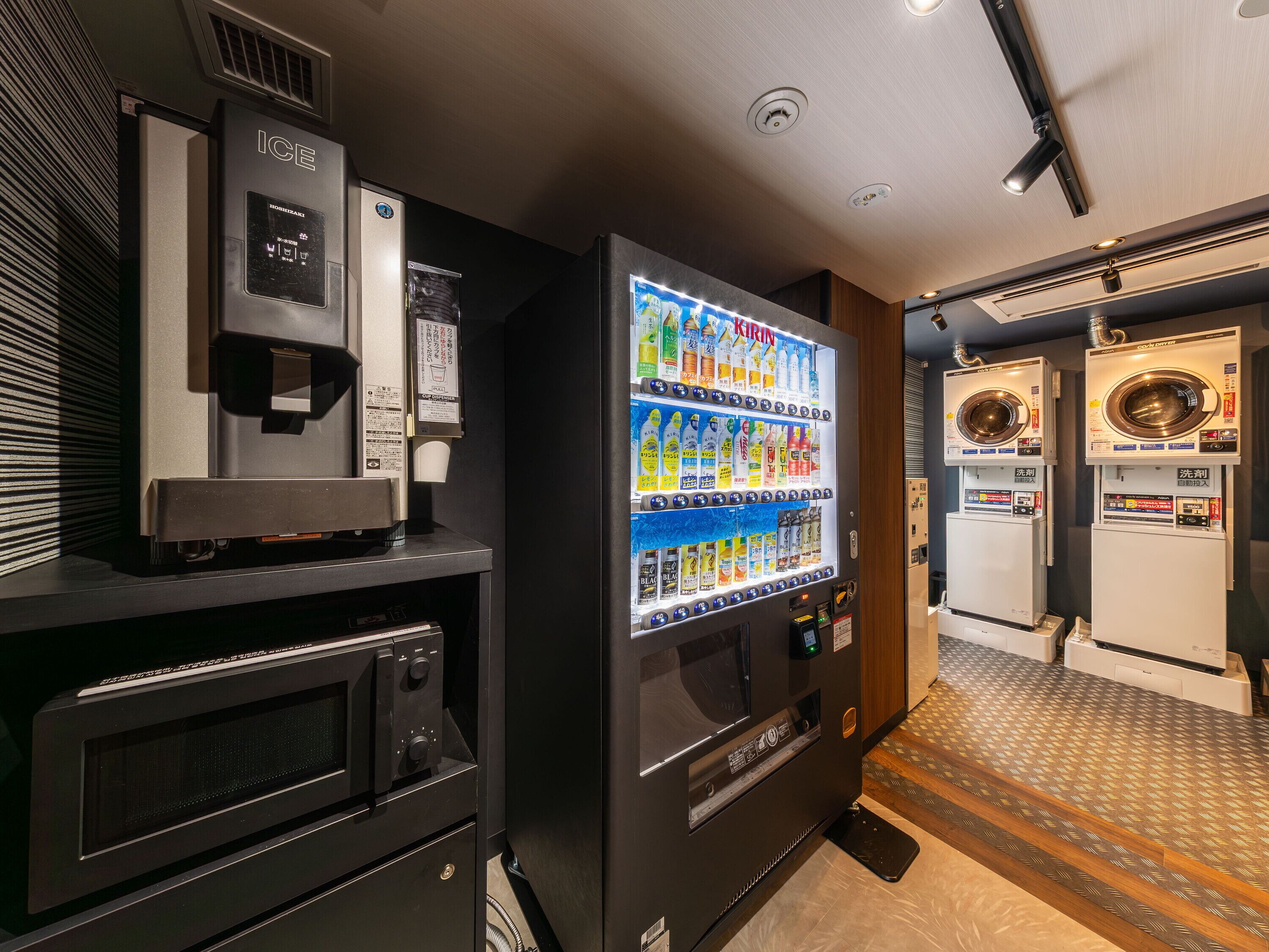A vending machine with beverages and a microwave.