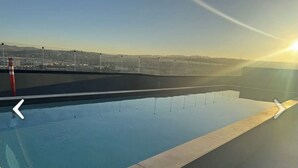 A rooftop pool with a clear view of the cityscape in the background. -  Luxury studio w/ rooftop infinity pool & TJ sunset views Cosmopolitan tower!…. (Tijuana)