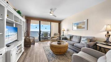 Signature Condo, 3 Bedrooms, Balcony, Beach View | Living room | 55-inch Smart TV with cable channels