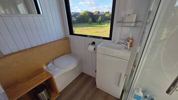 Shower, hair dryer, towels, shampoo