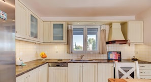 Fridge, oven, dishwasher, coffee/tea maker