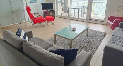 This charming two-room apartment in Port Scaldis (no. 19-42) offers a unique combination of sea and countryside views, making it perfect for a relaxing holiday on the Zeeland coast.