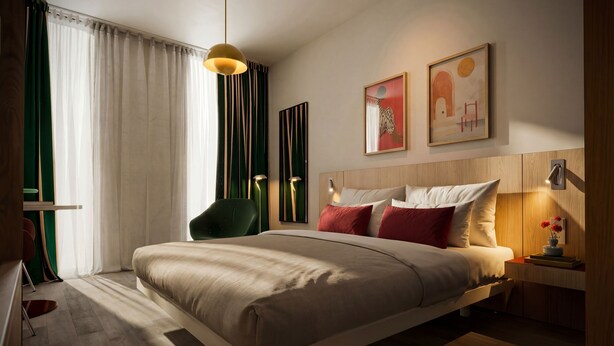 Un dormitorio moderno con una cama grande, una silla verde, una mesita de noche con lámpara y una obra de arte en la pared.