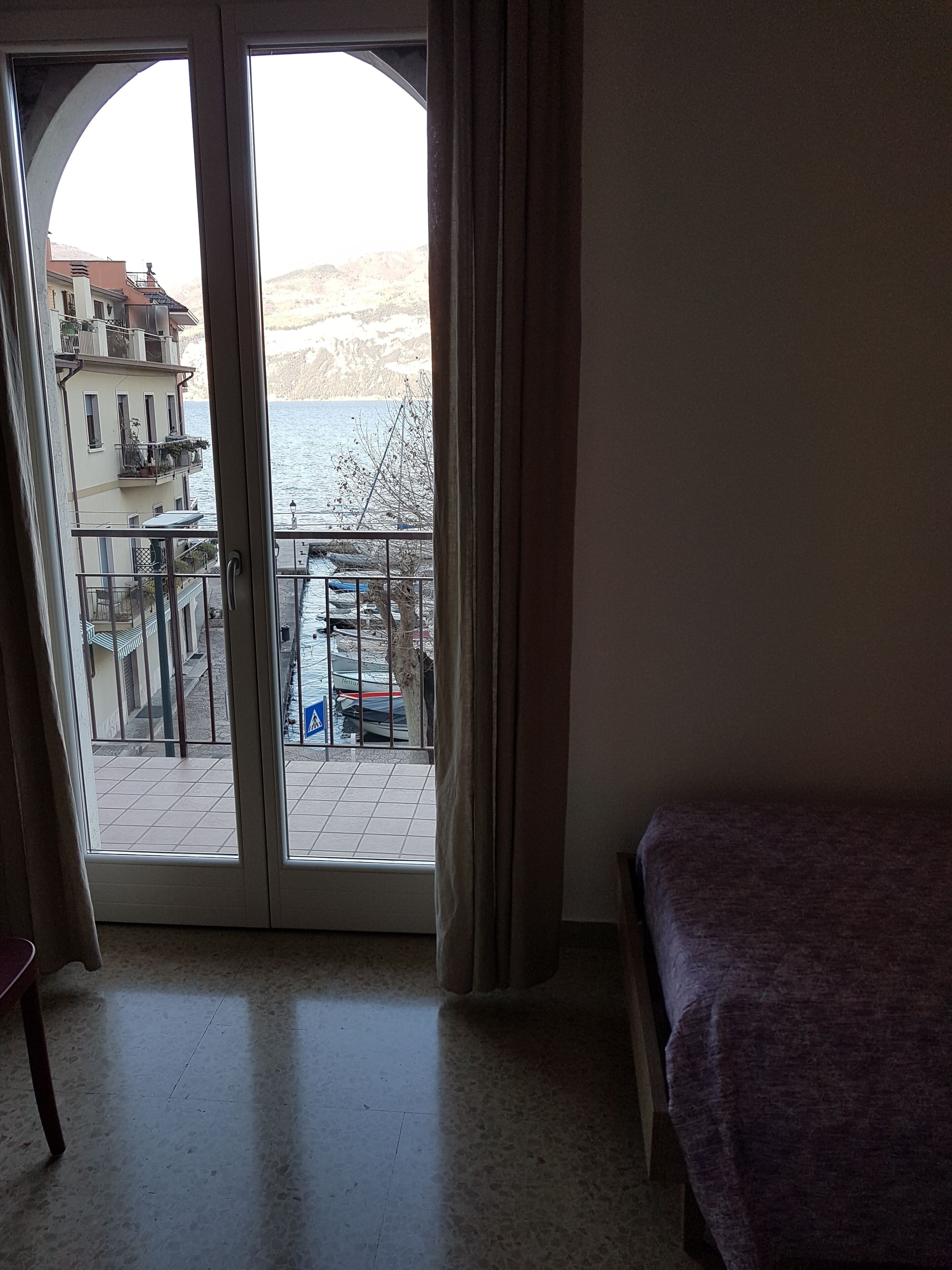 Apartment, Balcony, Lake View | Living area | Flat-screen TV