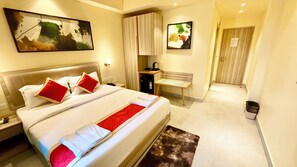 Premium bedding, desk, laptop workspace, soundproofing