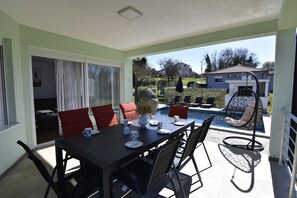 Outdoor dining - Comfortable holiday home with pool (Buroli)
