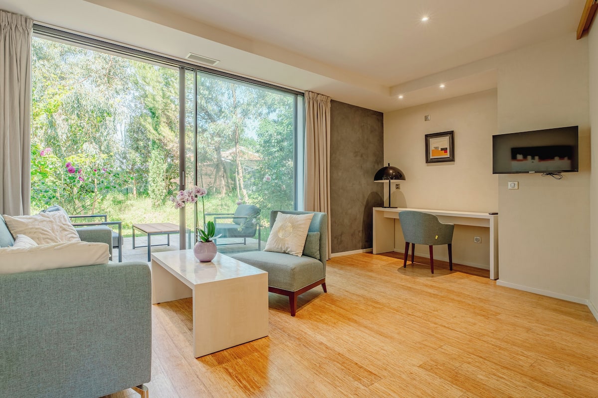 Doppia Deluxe, vista giardino | Area soggiorno | TV a schermo piatto, Netflix, servizi in streaming, stampante