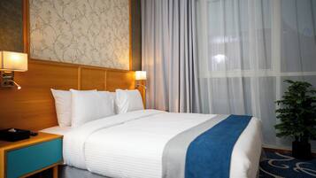 Suite Exécutive | Couette en duvet d'oie, surmatelas, minibar