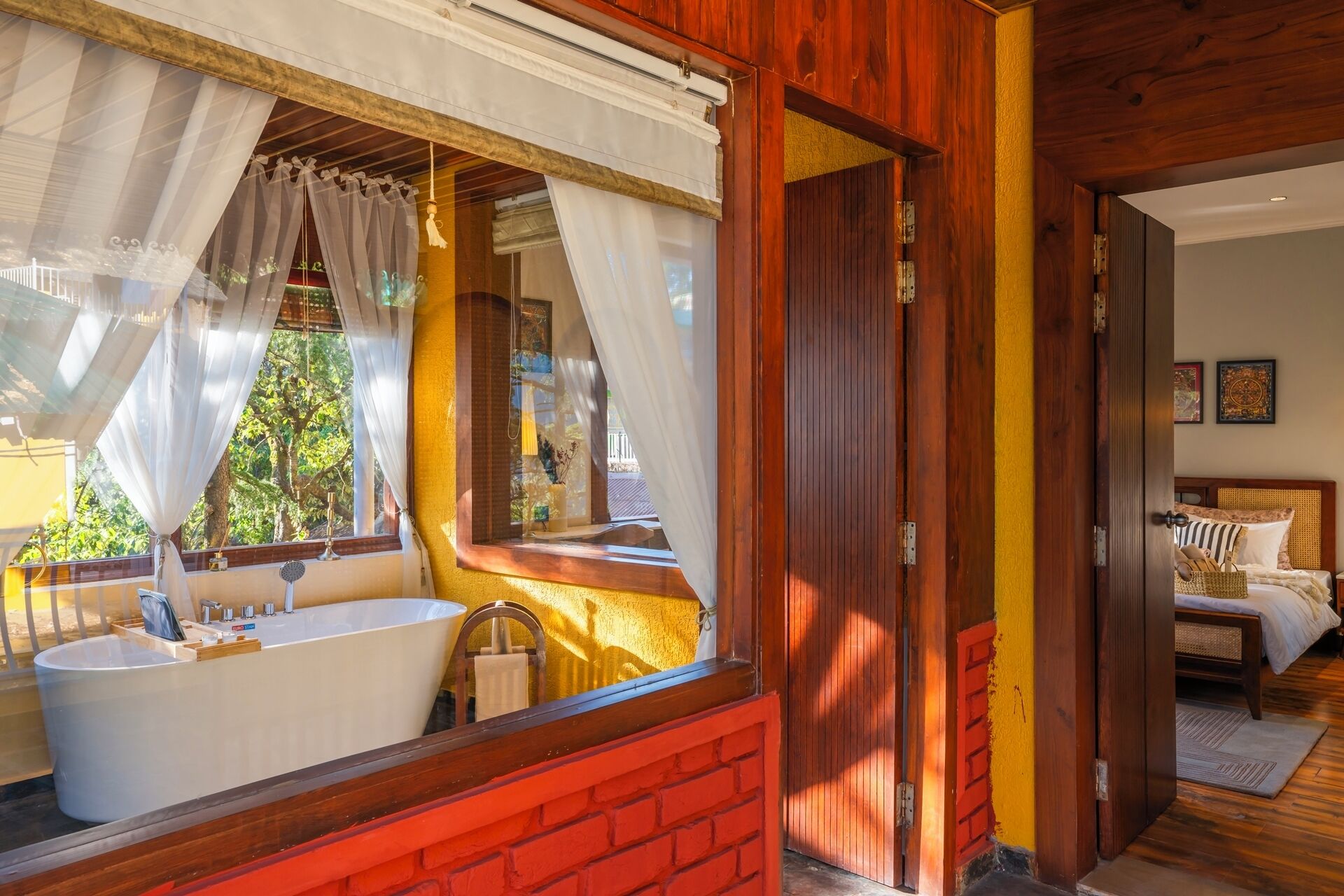 A bathroom with a bathtub, a sink, and a mirror.