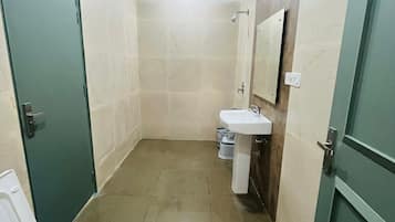 Shower, free toiletries, towels, toilet paper