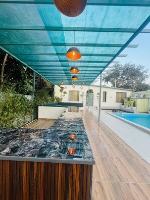 Outdoor pool - Olivine By Housiify (Gurugram)