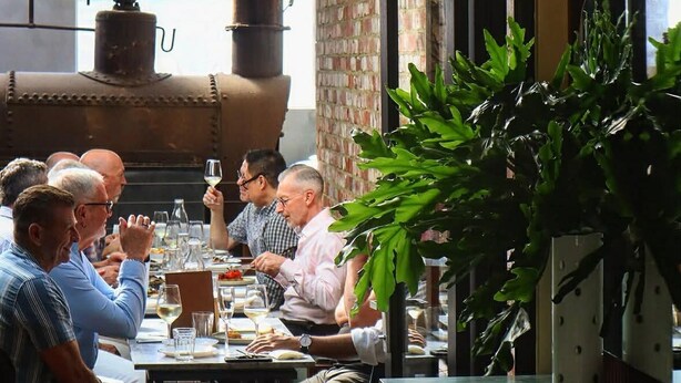 A restaurant with outdoor seating, a brick wall, and a large industrial stove. - Light-Filled North Perth Stay | Walk to Cafes | Stylish & Central (North Perth)