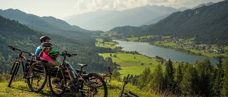 A mountain view with a lake and a town in the valley.