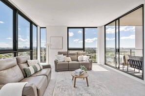 Living area - Waterfront Apartment with Panoramic City Views (Wolli Creek)