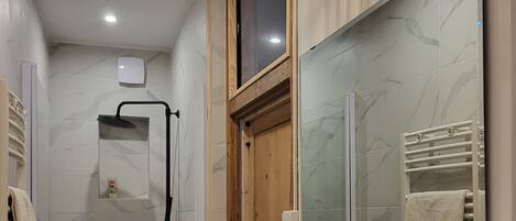 Shower, hair dryer, towels, soap