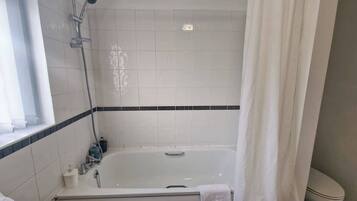 Shower, hair dryer, towels, shampoo