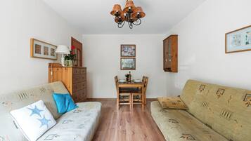 Comfort Apartment, Balcony | Living area | Flat-screen TV